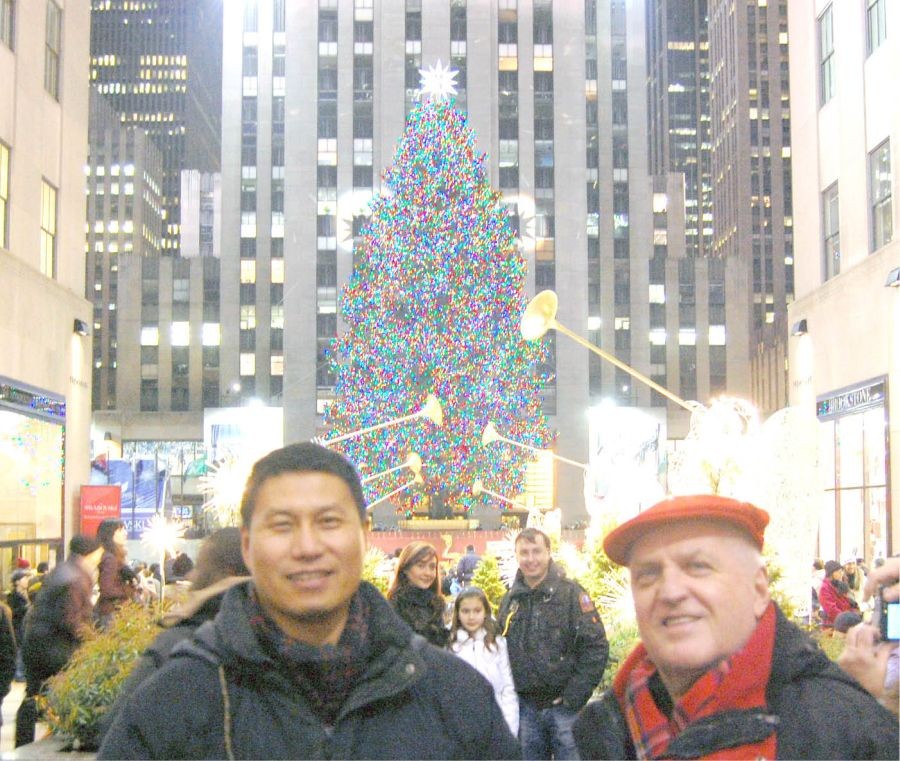 Christmas tree at the Rockefeller Plaza, New York City. In the foreground, Abraham Lotha and Limathung Yanthan.